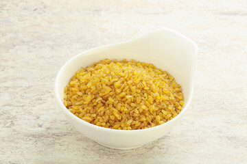 Raw bulgur in the bowl