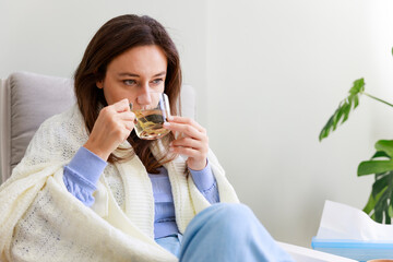 Woman drinking herb tea