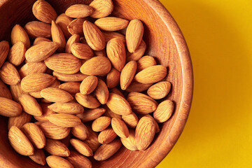 Almonds on a wooden surface.