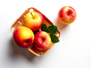 Bright apples in a wicker basket on a white background