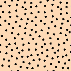 Abstract black hearts on beige background seamless pattern.  Best for textile, wrapping paper, package and home decoration.