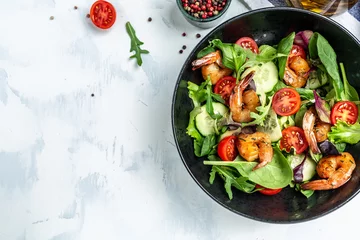 Fotobehang Seafood salad with smoked shrimps, cherry tomatoes, cucumber and mixed leaves. Healthy eating concept. Detox diet. Vegetarian lunch. Weight loss, top view © Надія Коваль