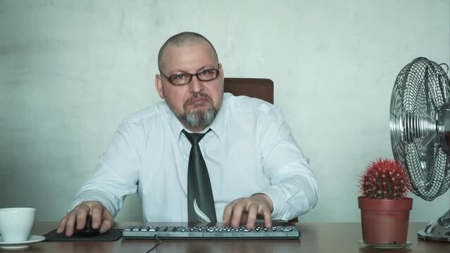 A man is typing very fast on the keyboard.