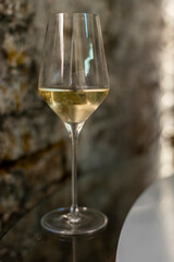 Tasting of brut champagne sparkling wine produced by traditional method in underground caves