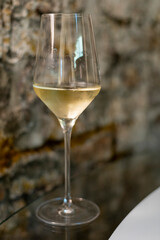Tasting of brut champagne sparkling wine produced by traditional method in underground caves