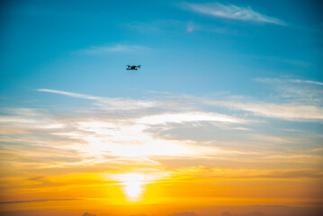 airplane in the sky at sunset
