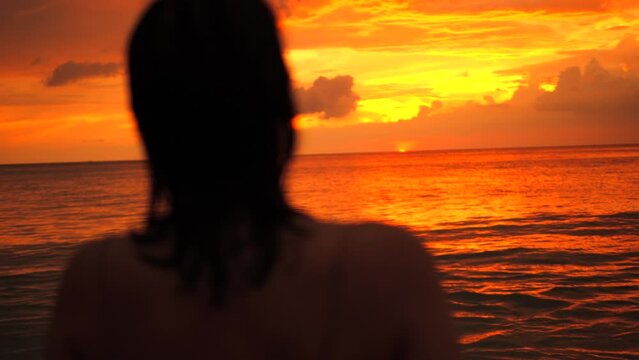 Young Attractive Tourist Girl Taking Photos of Amazing Colourful Sunset Sky. Female in Bikini Making Photos with Smartphone near Beach. High Quality 4K Slowmotion Tropical Life. Phuket, Thailand.