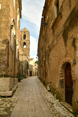 Fototapeta premium A narrow street among the old stone houses of the oldest district of the city of Caserta.