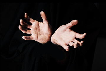 Theyre coming to grab you. Two hands isolated against a black background.