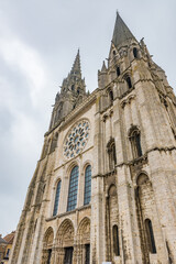Fototapeta premium Gothic Chartres Cathedral (Cathedral of Our Lady of Chartres or Notre-Dame de Chartres, 1220) - Catholic cathedral of Latin Church. Chartres (90 kilometers southwest of Paris), Eure-et-Loir, France.
