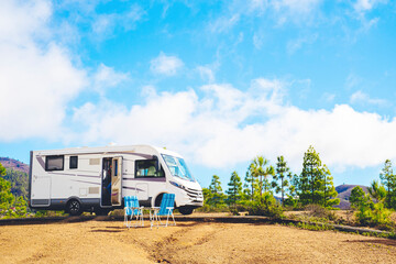 Beautiful tourism camper van campsite in the nature. Travel and rv renting vehicle vacation....