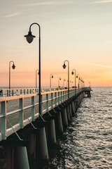 Gdynia Orlowo pier in the morning with colors of sunrise. Baltic Sea, Poland