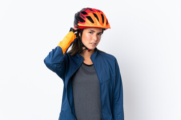 Young cyclist brazilian girl isolated on white  background having doubts