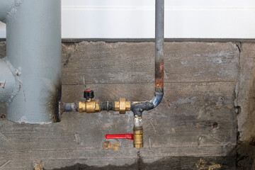 erting a pipe into a heating system. Installation of a heating unit in a production room. Metal pipes for heating.