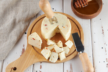 Cheese collection, craft cow and goat milk cheese, wooden table