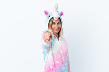 Obraz na płótnie Canvas Blonde Uruguayan girl wearing a unicorn pajama isolated on white background points finger at you with a confident expression