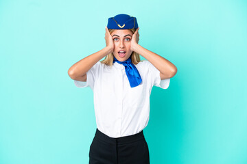 Airplane stewardess Uruguayan woman isolated on blue background with surprise expression