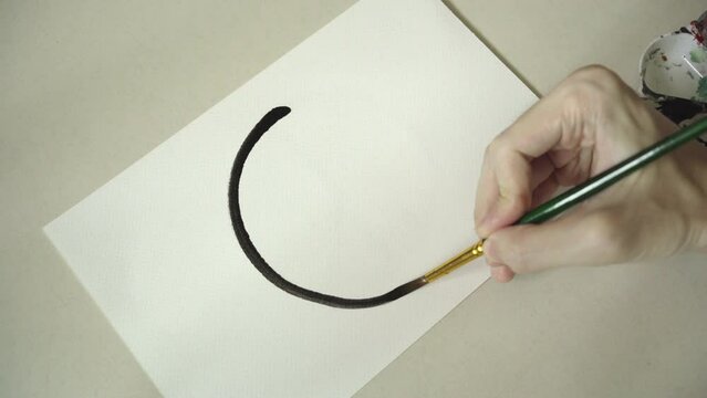 Drawing peace symbol on white paper