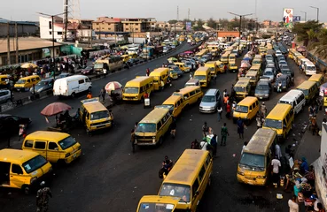 Keuken foto achterwand New York taxi Lagos city bus park - Endless Streams of danfo navigating the bustling traffic of Lagos 