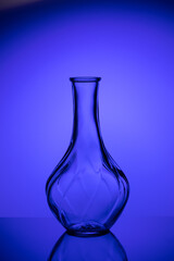 Obraz na płótnie Canvas Blank Liquor bottle. Drink blue background