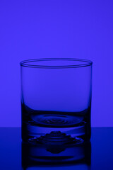 Blank Liquor glass. Drink . Blue background