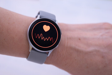 Heart rate check with smart watch. Close-up