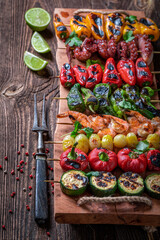 Healthy grilled skewer made of mediterranean seafood and vegetables.