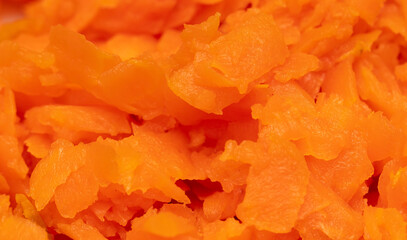 Orange boiled carrots as a background.