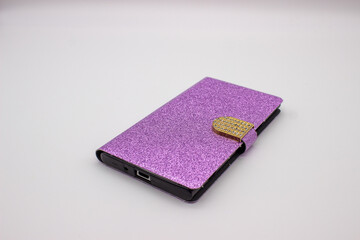 Phone in pink case on gray background