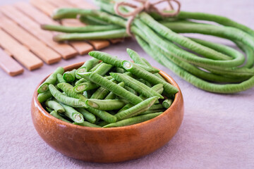 Yard long bean in wooden bowl