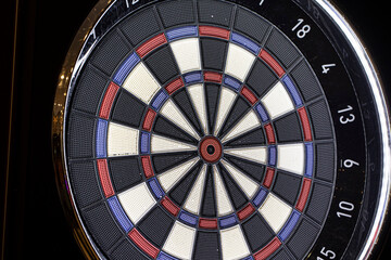 darts board on a black background. game center.