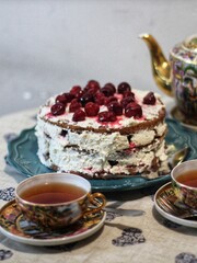 Cherry cake with cup of tea isolated