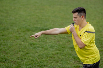 Referee showing on penalty while gaming. Concept of sport, rules violation, controversial issues,...
