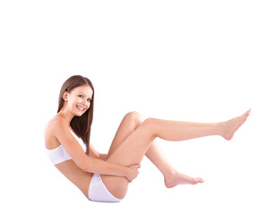 Fototapeta premium That is smooth.... Full body studio shot of a young woman caressing her bare leg.