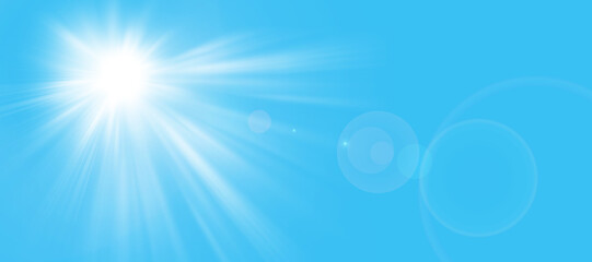 Obraz premium Sunny background, sun in summer on blue sky with lens flare...The sun's rays and the lens light up in a bright blue sky...Panorama format. Space for your own text.