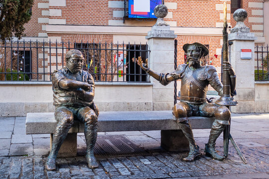 Spain, Dec 2021: Don Quijote and Sancho Panza sculptures in the street of Alcal&aacute; de Henares, Spain