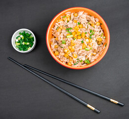 Asian fried rice with corn and parsley close-up on a plate.