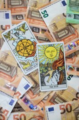 Fototapeta na wymiar Euro banknotes and Tarot cards