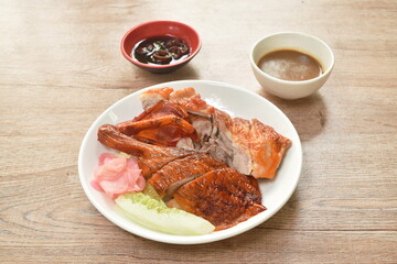 roasted duck meat and pickled ginger dressing sweet soy sauce on plate