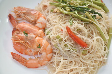 spicy fried rice vermicelli with shrimp  and mimosa on plate