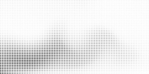 Halftone dotted background. Black dots in modern style on a white background.