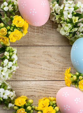 Frame of easter eggs and flwers