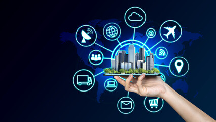 Businessman holding a digital mobile phone with Smart city and icons, networks internet of things.