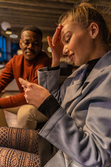 She is lookig at the word and thinking