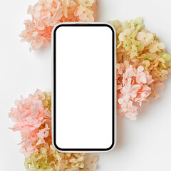Smartphone mockup with pink and green flowers. Device screen mock up on stylish background for presentation or appl design