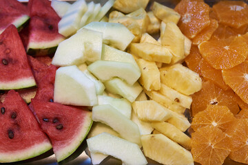 fresh, sliced fruit - watermelon, mango, pineapple, orange