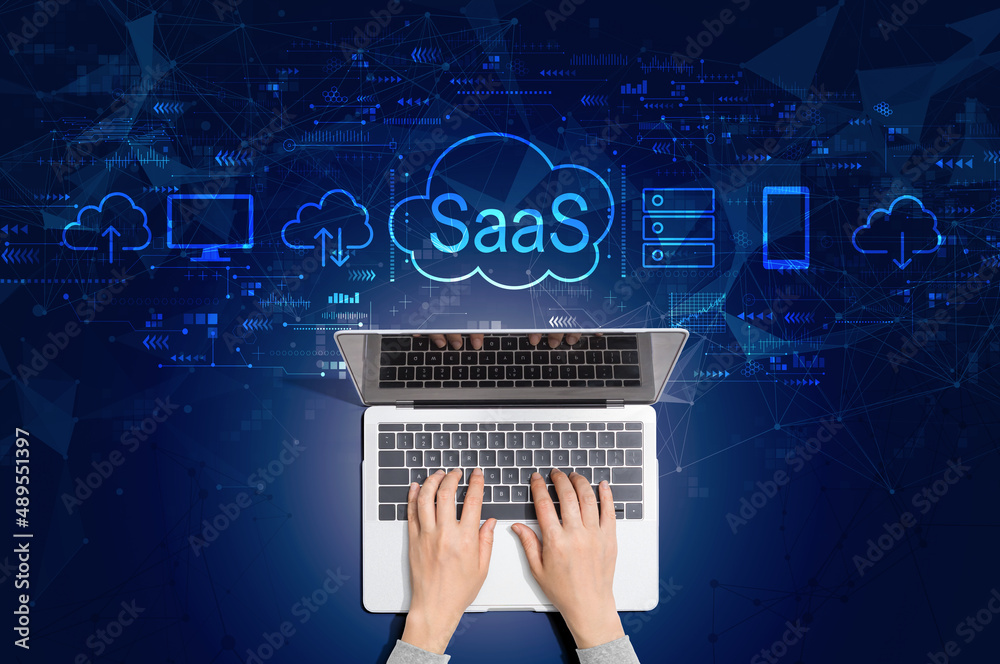 Poster saas - software as a service concept with person using a laptop computer