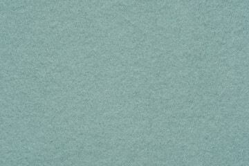 A flannelette. The backside of a knitted fabric with fleece. A napped cotton jersey fabric, light green flannel cloth.