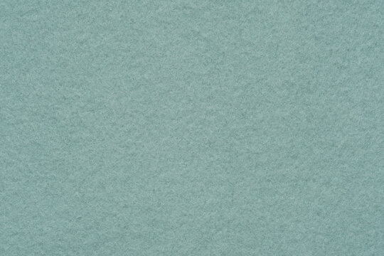 A flannelette. The backside of a knitted fabric with fleece. A napped cotton jersey fabric, light green flannel cloth.