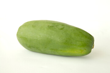 one raw organic fresh green papaya fruits isoleted on white background, flat lay, top view